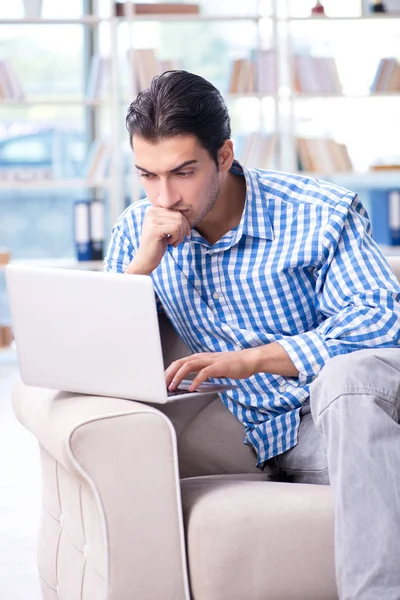 Caucasian student with laptop preparing for university exams — Stock Photo, Image