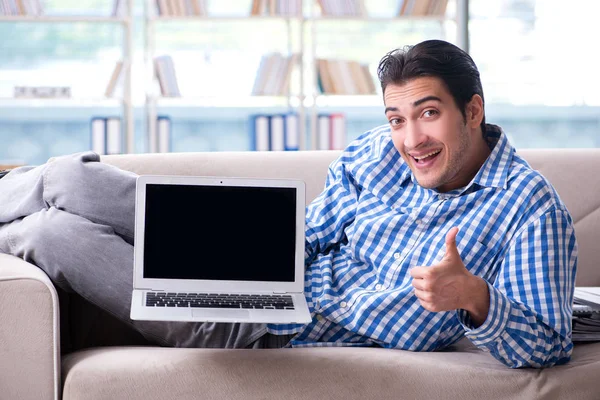 Caucasian student with laptop preparing for university exams — Stock Photo, Image