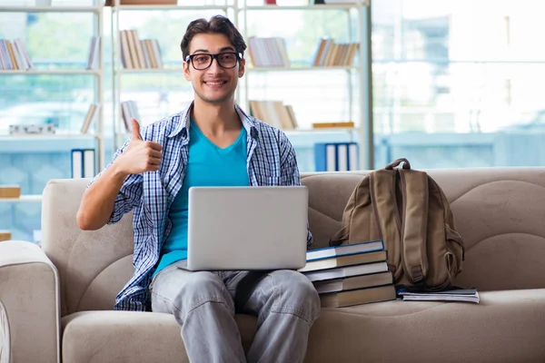 Caucasian student with laptop preparing for university exams — Stock Photo, Image