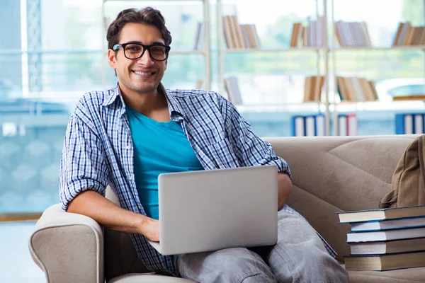 Caucasian student with laptop preparing for university exams — Stock Photo, Image