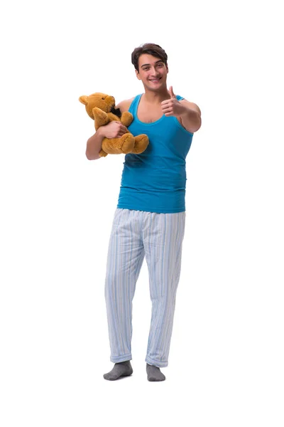 Jovem de pijama com brinquedo animal isolado no backgroun branco — Fotografia de Stock