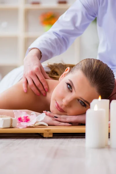 Young woman during spa procedure in salon