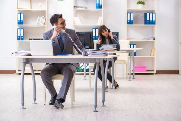 Man and woman working in the office