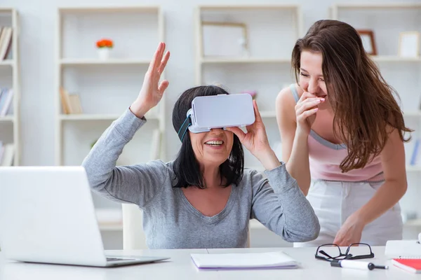 Senior woman experiencing virtual reality glasses