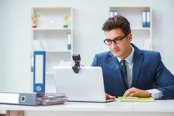 Young help desk operator working in office