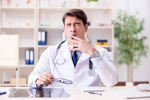 Young doctor sitting in the office — Stock Photo, Image