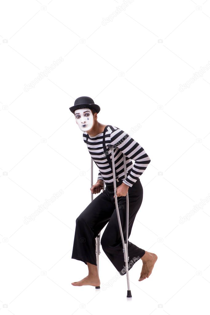 Mime with crutches isolated on white background