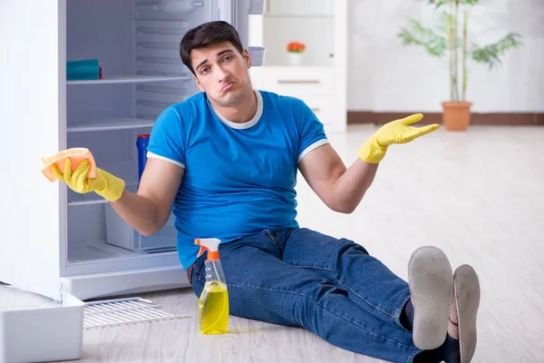 Man cleaning fridge in hygiene concept — Stock Photo, Image