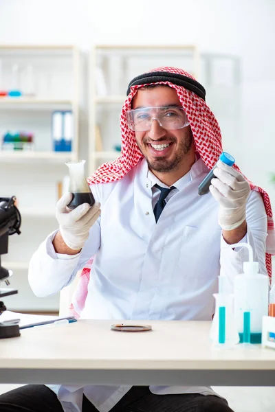 Arab chemist scientist testing quality of oil petrol — Stock Photo, Image