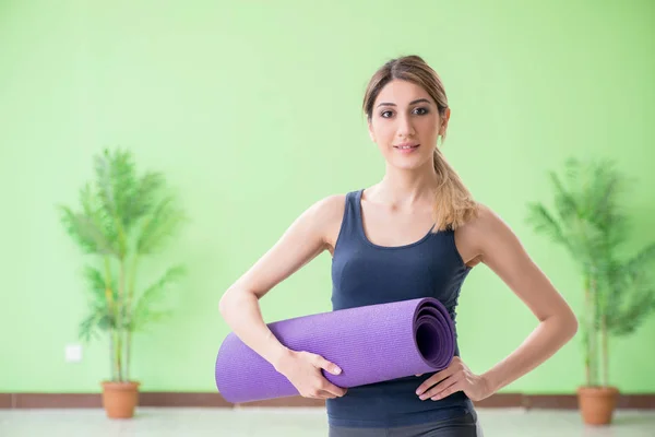 Woman doing exercises at home