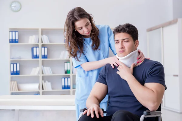 Man with neck injury visiting doctor for check-up