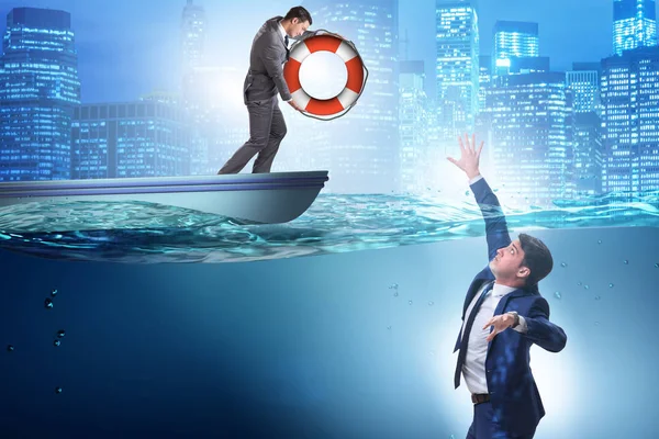 Businessman being saved from drowning — Stock Photo, Image