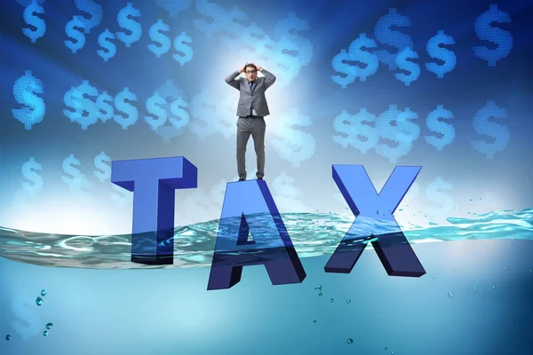 Businessman having problems with paying taxes — Stock Photo, Image