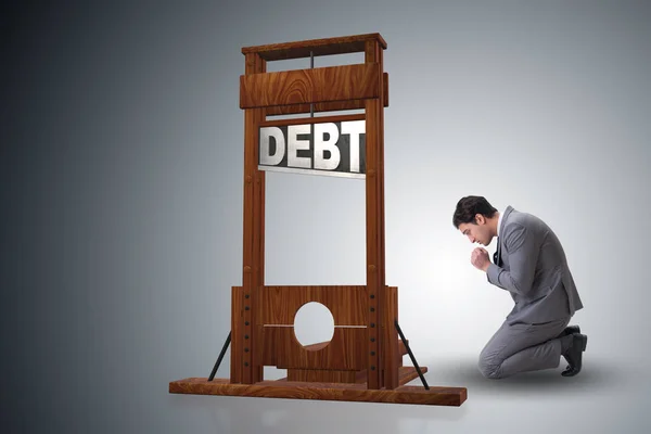 Uomo d'affari nel concetto di business del debito pesante — Foto Stock