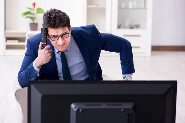 Businessman watching tv in the office