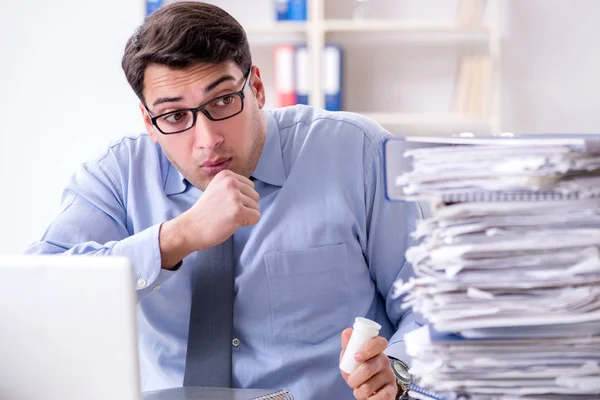 Extremely busy businessman working in office — Stock Photo, Image