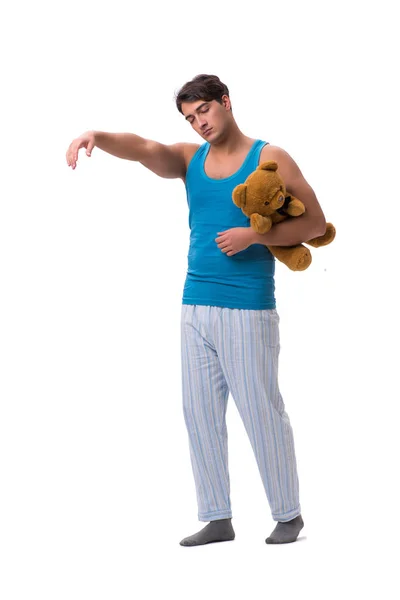 Joven en pijama con juguete animal aislado sobre fondo blanco — Foto de Stock