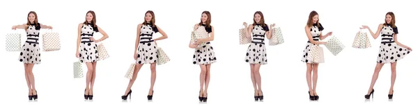 Young woman with shopping bags on white — Stock Photo, Image