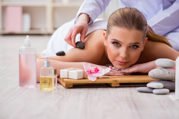 Young woman during spa procedure in salon