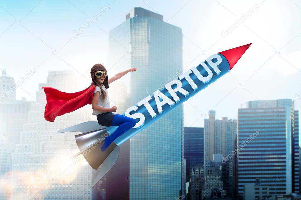 Small kid in start-up concept flying rocket