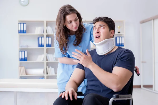 Man with neck injury visiting doctor for check-up