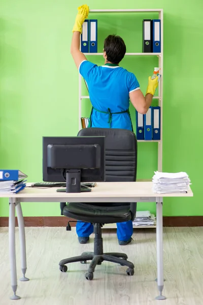 Male handsome professional cleaner working in the office — Stock Photo, Image