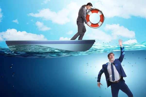 Businessman being saved from drowning — Stock Photo, Image