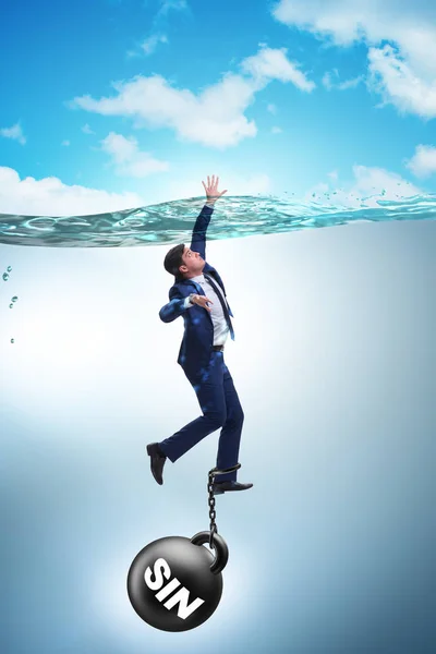 Businessman drowning under the burden of sin and guilt — Stock Photo, Image