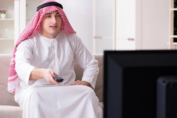 Arab man watching tv at home — Stock Photo, Image