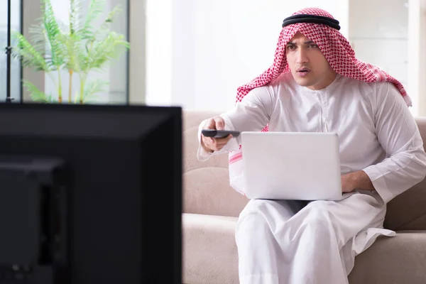 Arab man watching tv at home — Stock Photo, Image