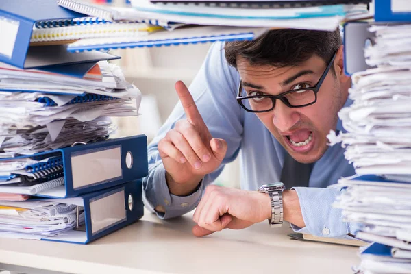 Extremely busy businessman working in office — Stock Photo, Image