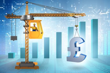 İnşaat vinci İngiliz poundunu kaldırıyor.
