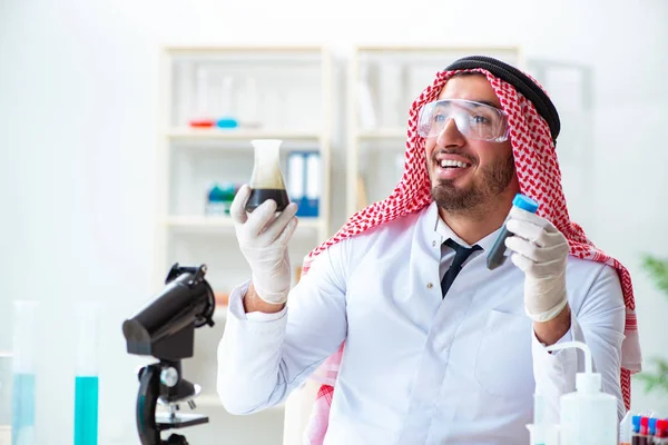 Arab chemist scientist testing quality of oil petrol — Stock Photo, Image