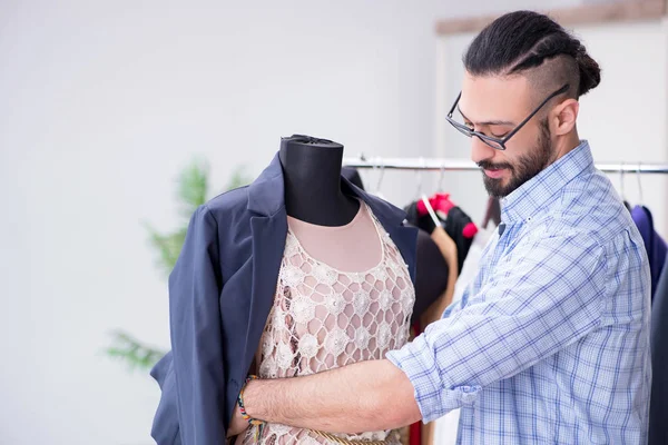 Male tailor working in the workshop on new designs — Stock Photo, Image