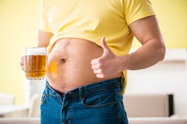 Fat obese man holding beer in dieting concept — Stock Photo, Image