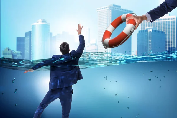 Businessman being saved from drowning — Stock Photo, Image