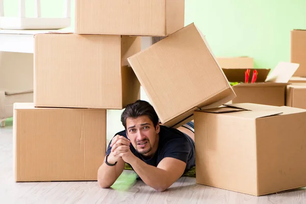 stock image Man moving house with boxes