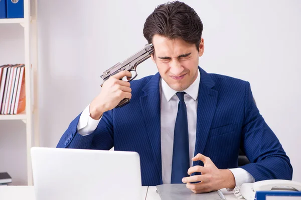 Young handsome businessman committing suicide in the office — Stock Photo, Image