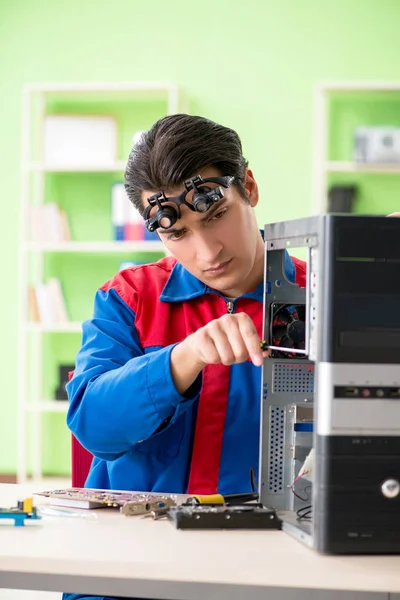 Computer engineer repairing broken desktop