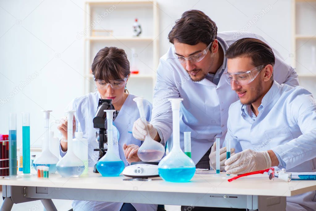 Team of chemists working in the lab