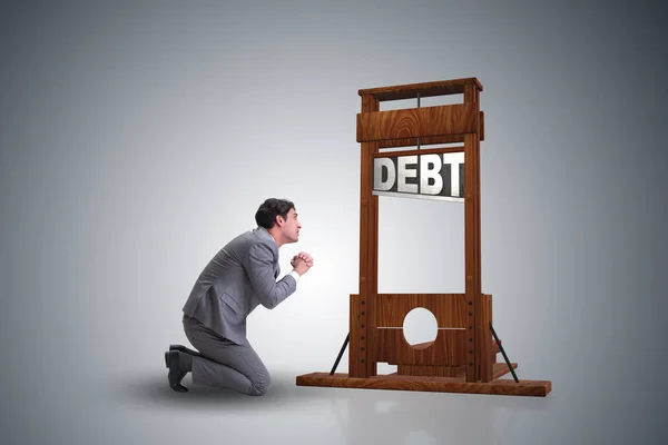 Uomo d'affari nel concetto di business del debito pesante — Foto Stock