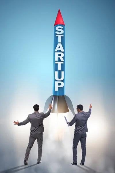 Start-up concept with rocket and businessman