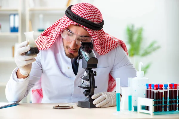 Arab chemist scientist testing quality of oil petrol — Stock Photo, Image