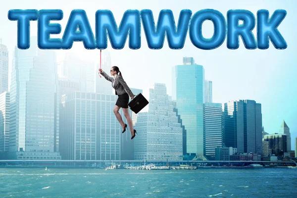 Businesswoman flying in teamwork concept — Stock Photo, Image