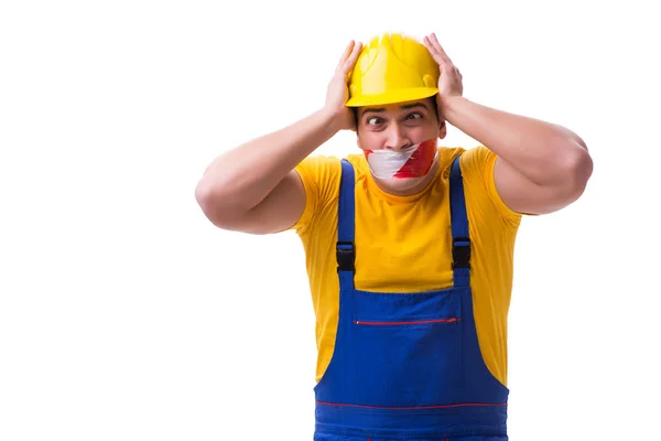 Trabalhador engraçado vestindo macacões com fita — Fotografia de Stock