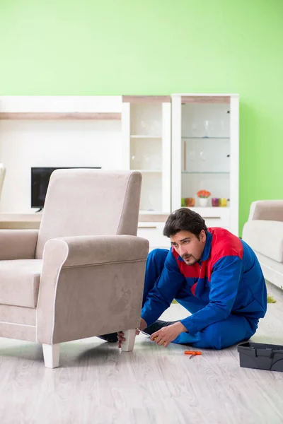 Repair contractor repairing broken furniture at home — Stock Image Repair contractor repairing broken furniture at home Royalty Free Stock Images