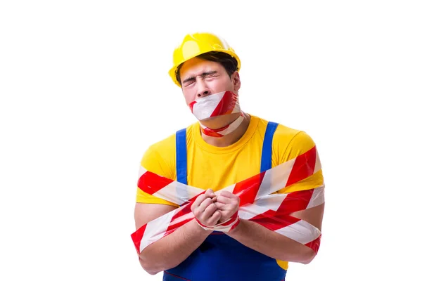 Funny worker wearing coveralls with tape — Stock Photo, Image