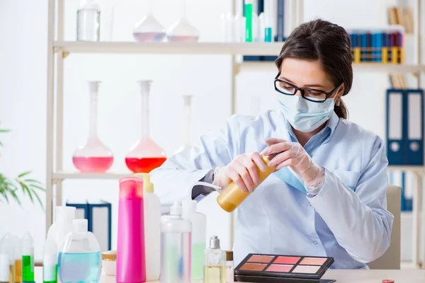 Lab chemist checking beauty and make-up products