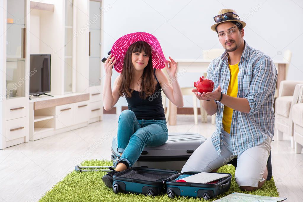 Young family packing for vacation travel