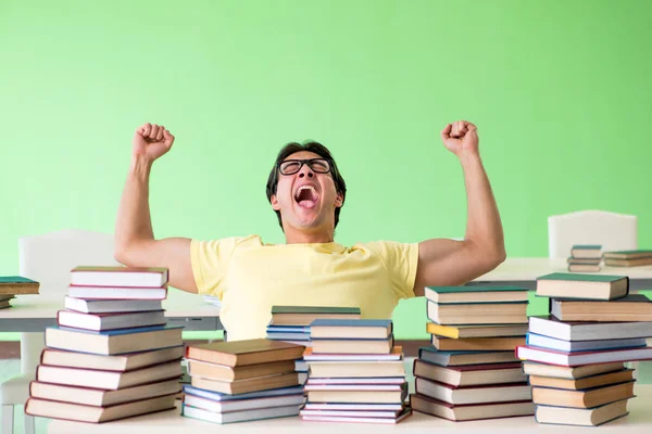 Student with too many books to read before exam — Stock Photo, Image